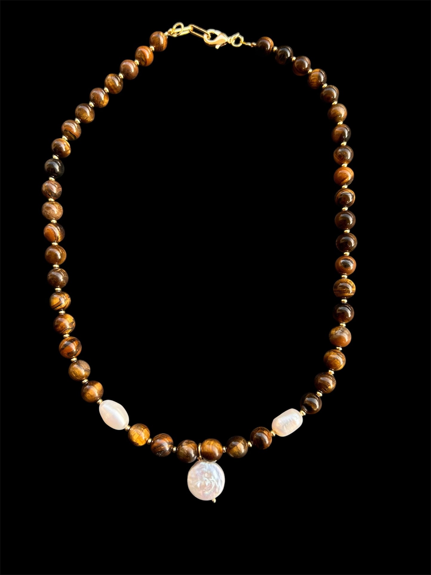 Natural Tiger’s Eye & Freshwater Pearls

Energy: Protection