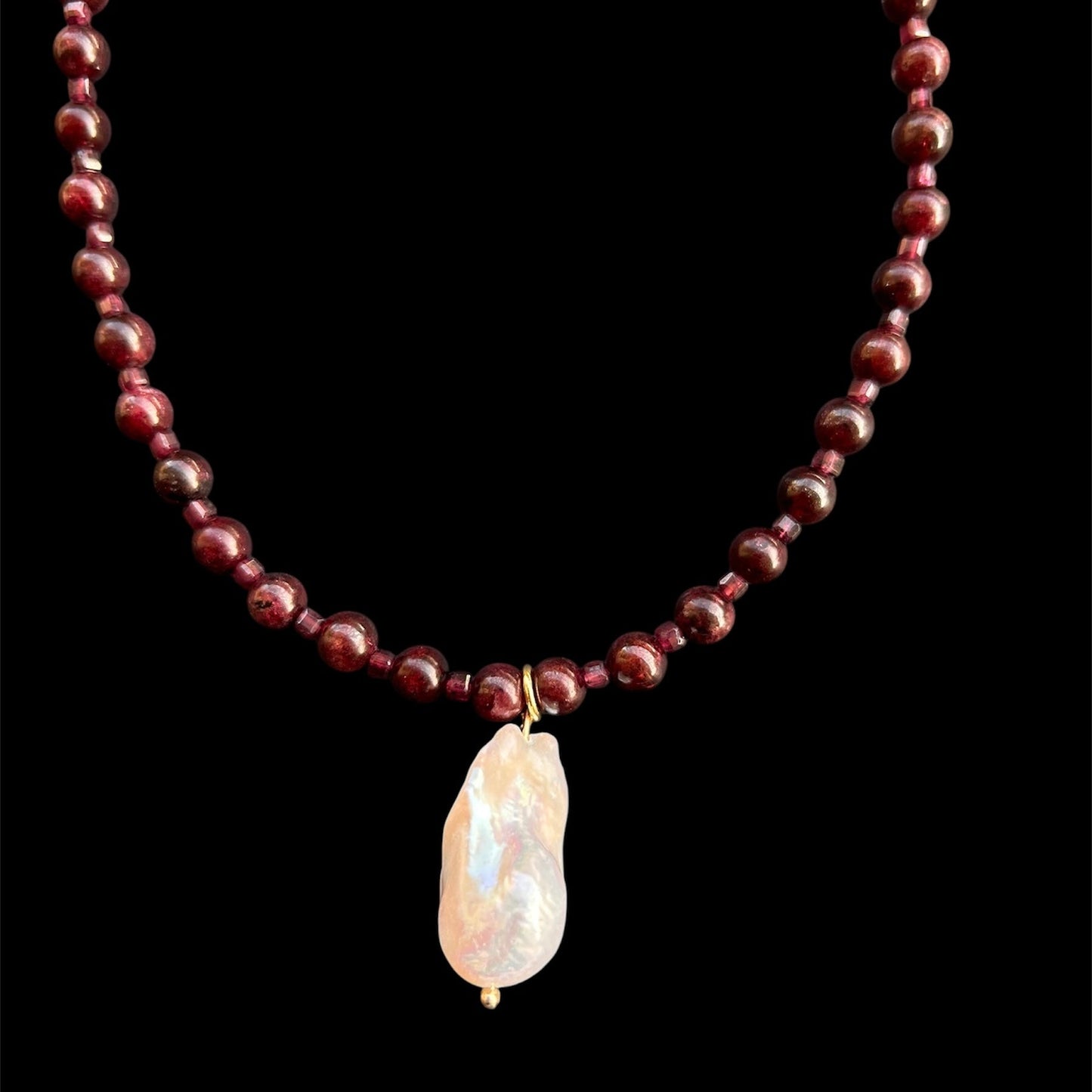 High-Grade Natural Garnet & Baroque Freshwater Pearl

Energy: Resilience