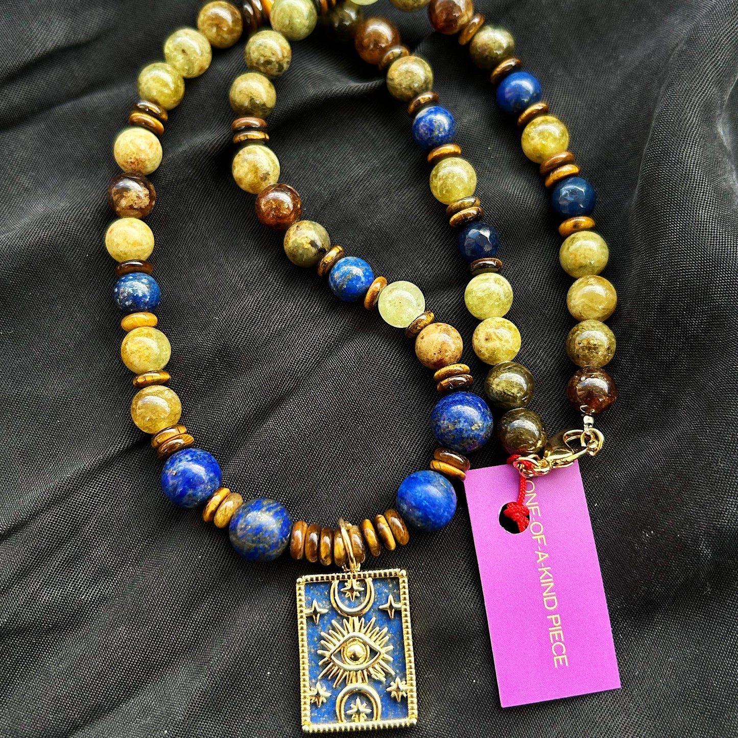 Midnight Oracle Necklace in natural Lapis lazuli, Peridot, and Tiger Eye, finished with a unique double-face pendant