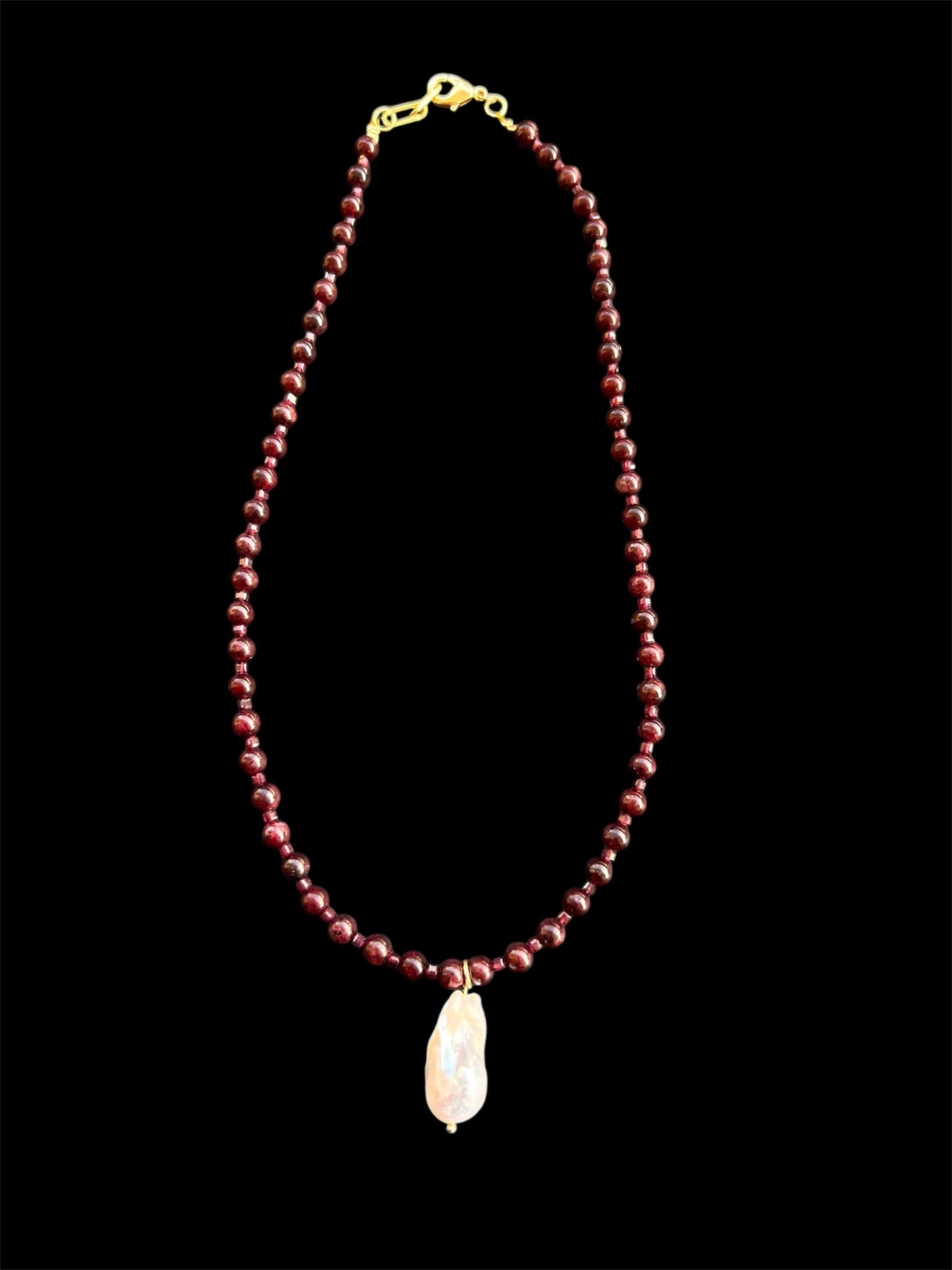 High-Grade Natural Garnet & Baroque Freshwater Pearl

Energy: Resilience